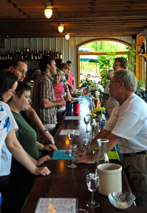Photo of our team serving guests in our Tasting Room