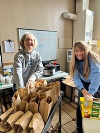 Jan Rosequist and Jill Rank of Keuka Spring pack lunches for The Living Well Mission's grab and go program