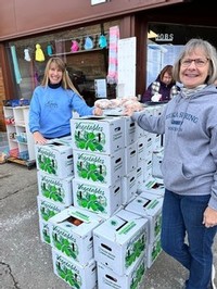 Jill Rank and Jan Rosequist assisted with food box distribution at the Living Well Mission