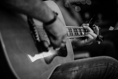 Jerry Martin playing guitar-guitar close up