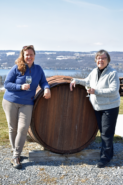 Jeanne and Judy Wiltberger by wine barrel